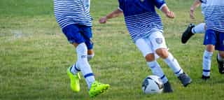 Shooters soccer players contesting the ball