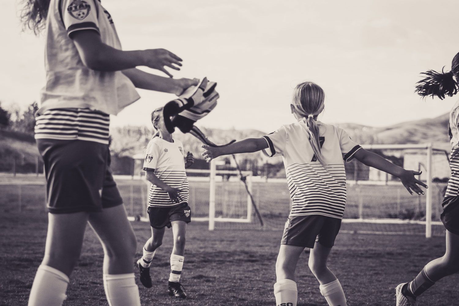 Girls soccer team celebrating a goal